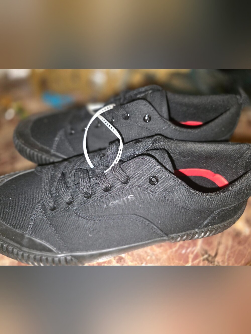 Levi's Women's Black Canvas Low-Top Sneakers with Red Insole Accent